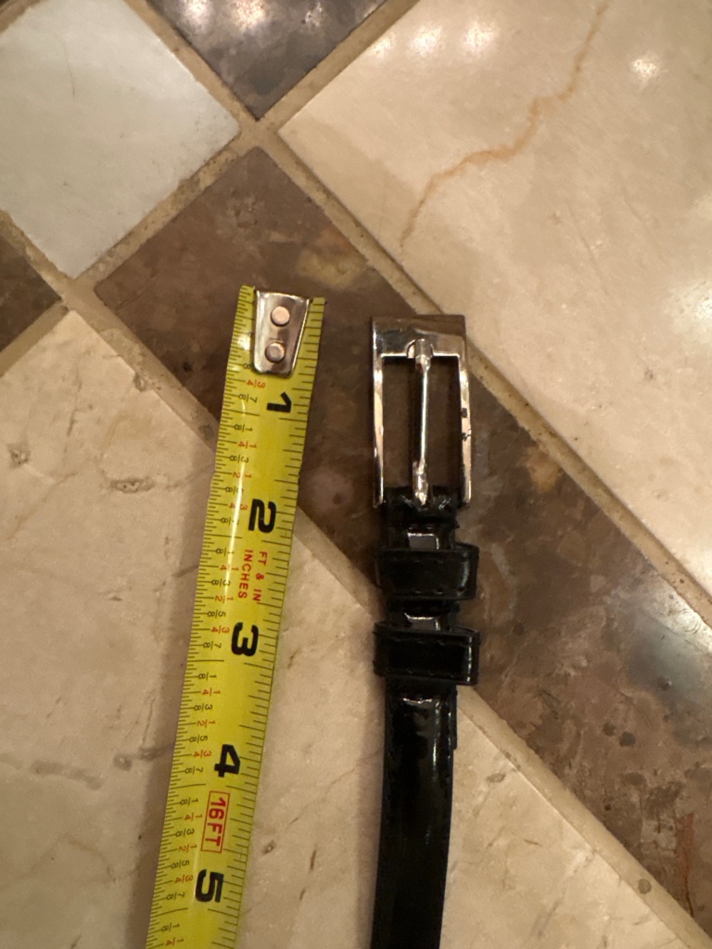 Women’s black patent leather with silver hardware belt
